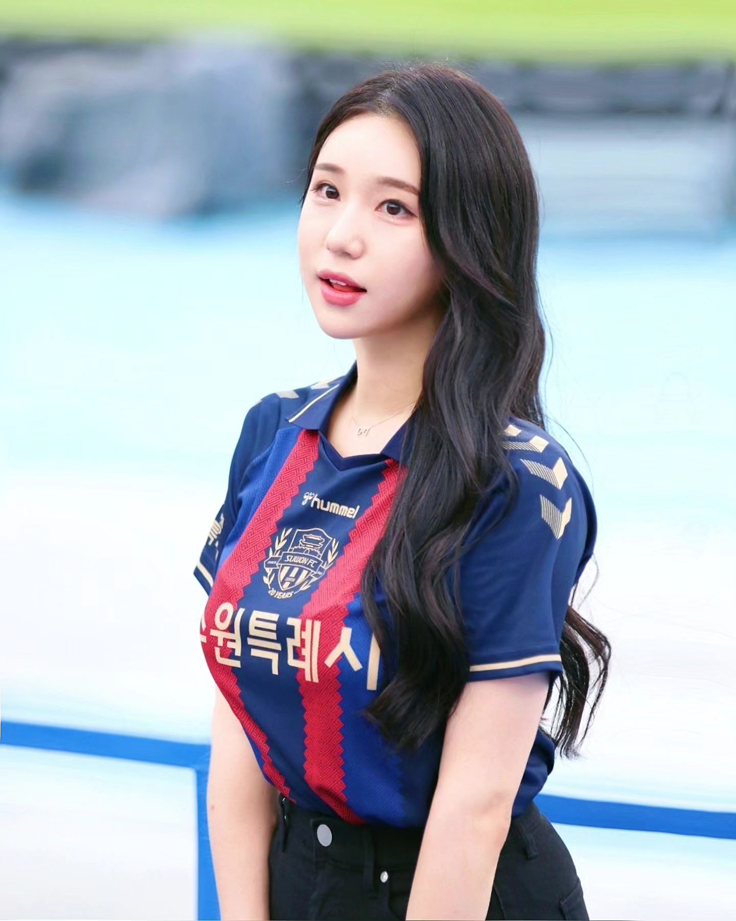 A collection of photos of Kim Hyun Young, a cheerleader model born in 2000, wearing Suwon FC uniforms