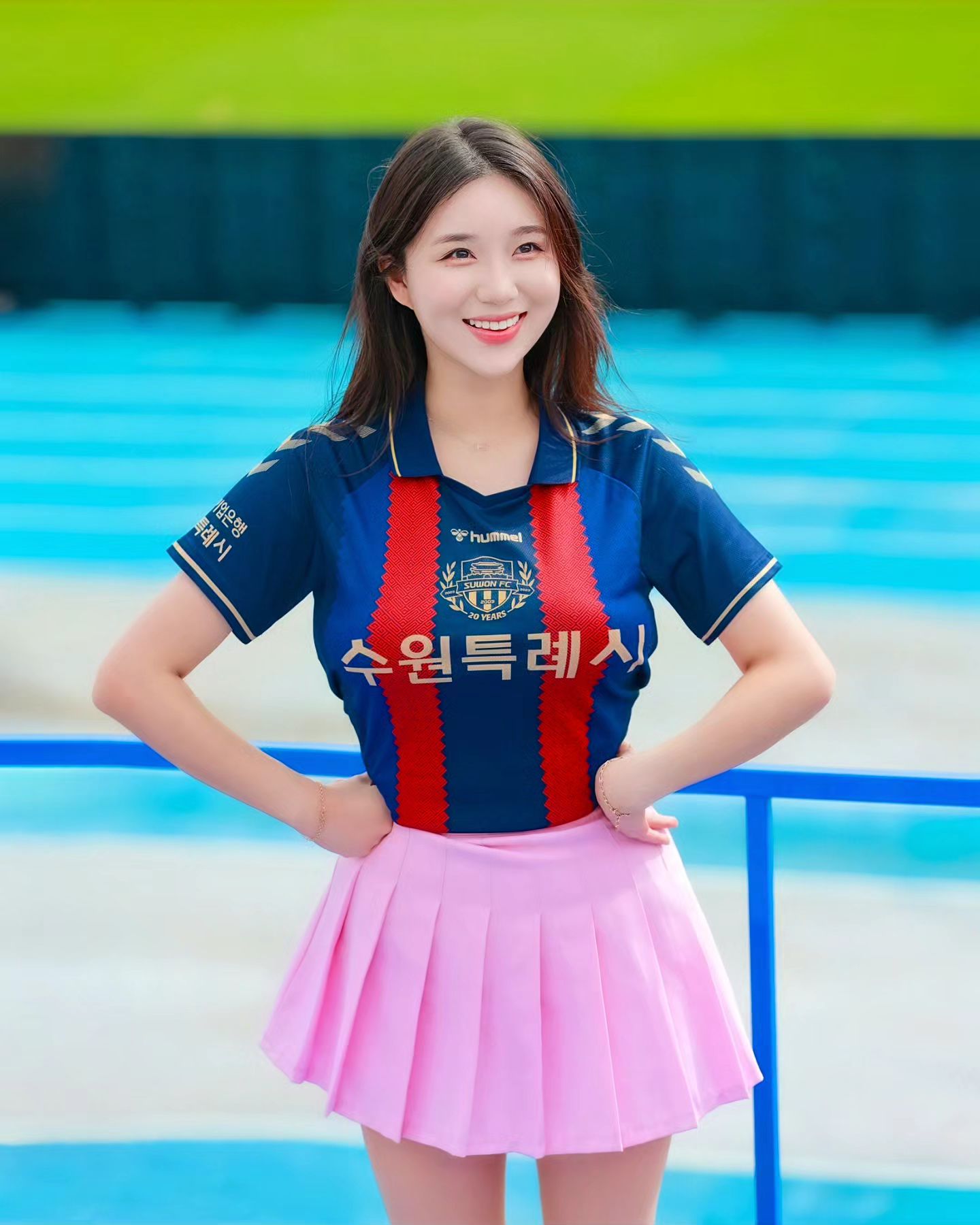 A collection of photos of Kim Hyun Young, a cheerleader model born in 2000, wearing Suwon FC uniforms