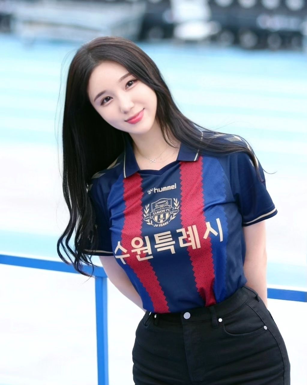 A collection of photos of Kim Hyun Young, a cheerleader model born in 2000, wearing Suwon FC uniforms