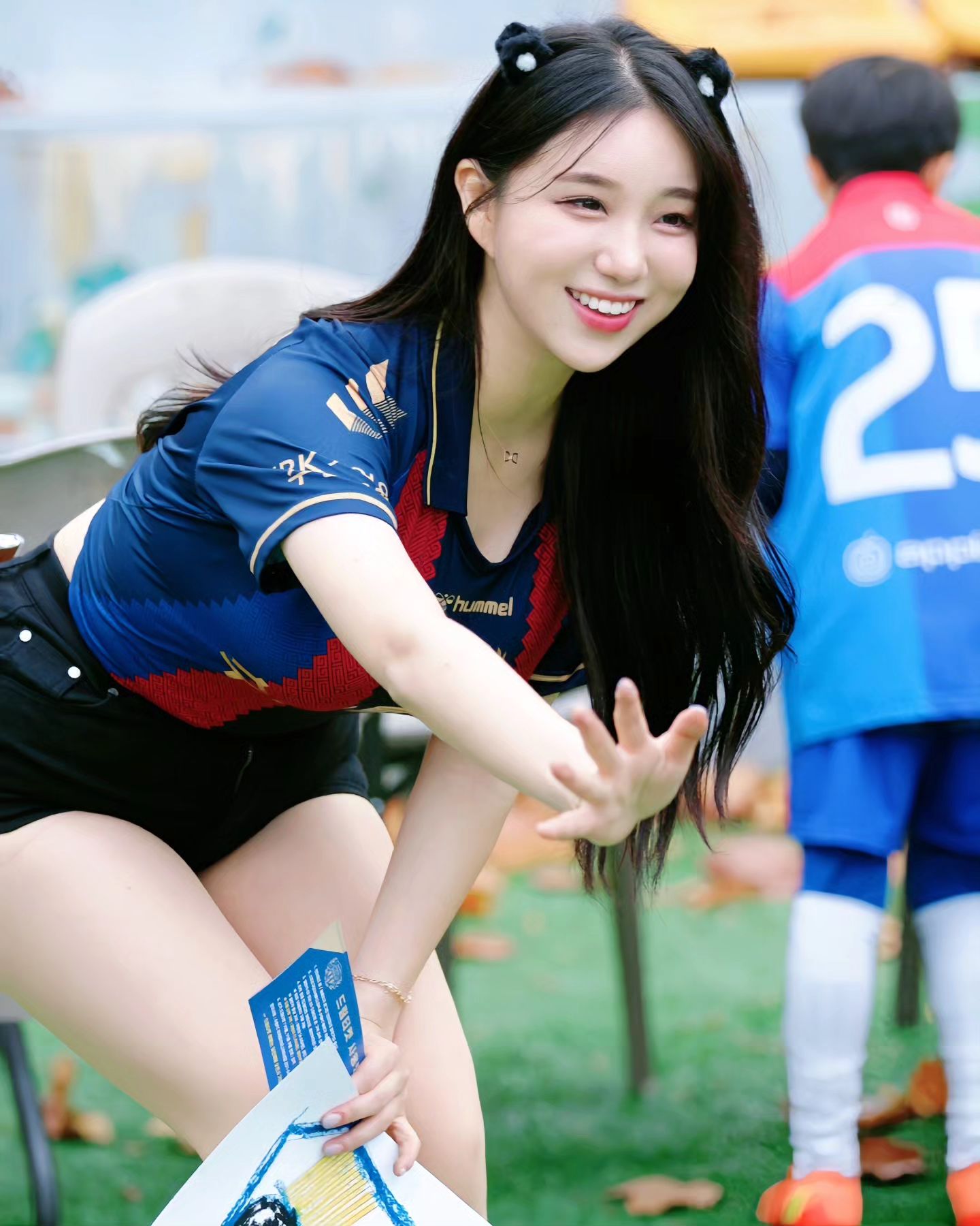 A collection of photos of Kim Hyun Young, a cheerleader model born in 2000, wearing Suwon FC uniforms