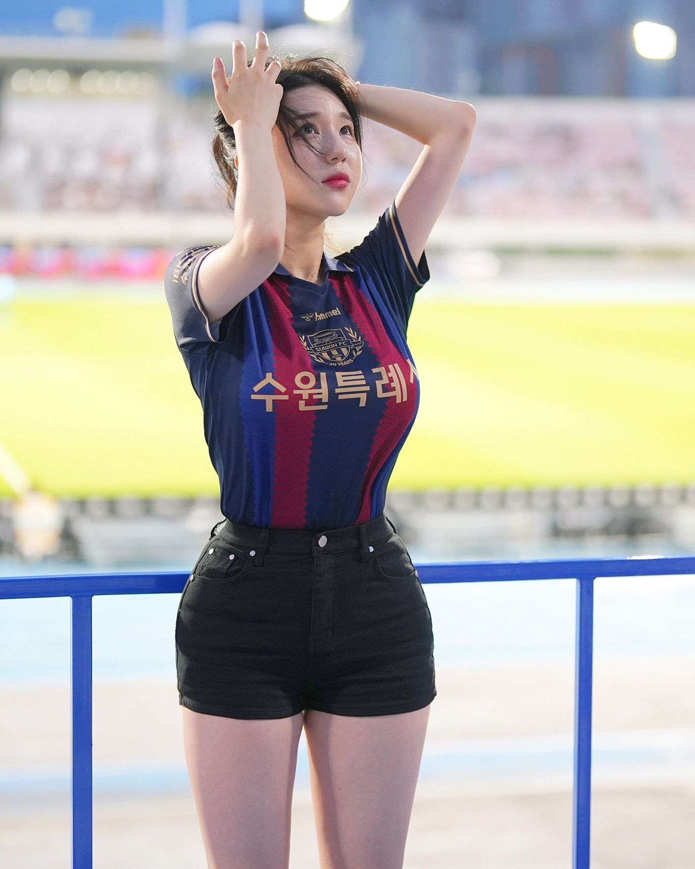 A collection of photos of Kim Hyun Young, a cheerleader model born in 2000, wearing Suwon FC uniforms