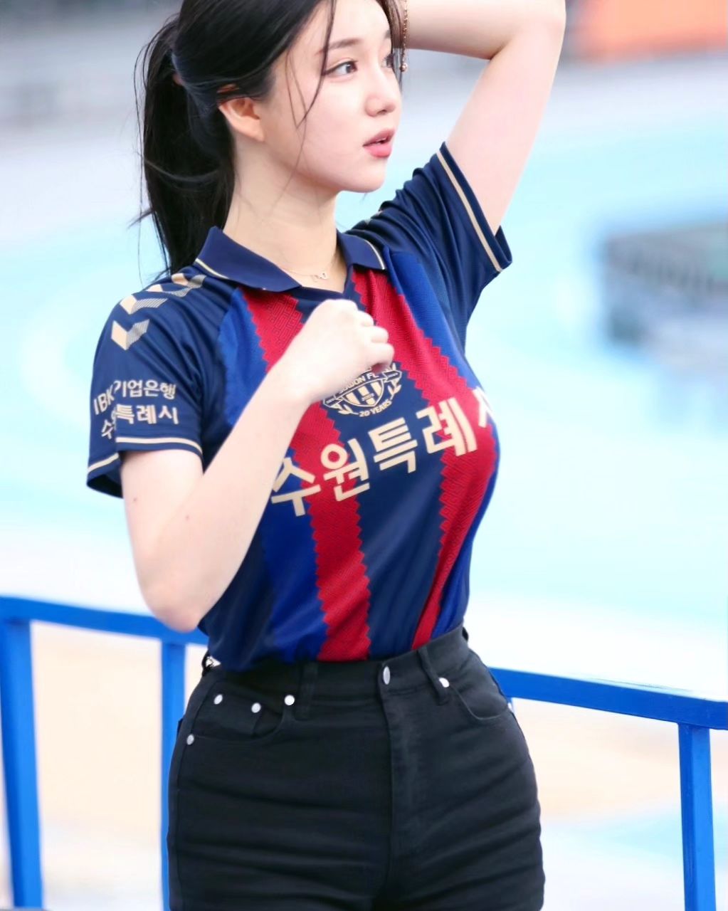 A collection of photos of Kim Hyun Young, a cheerleader model born in 2000, wearing Suwon FC uniforms